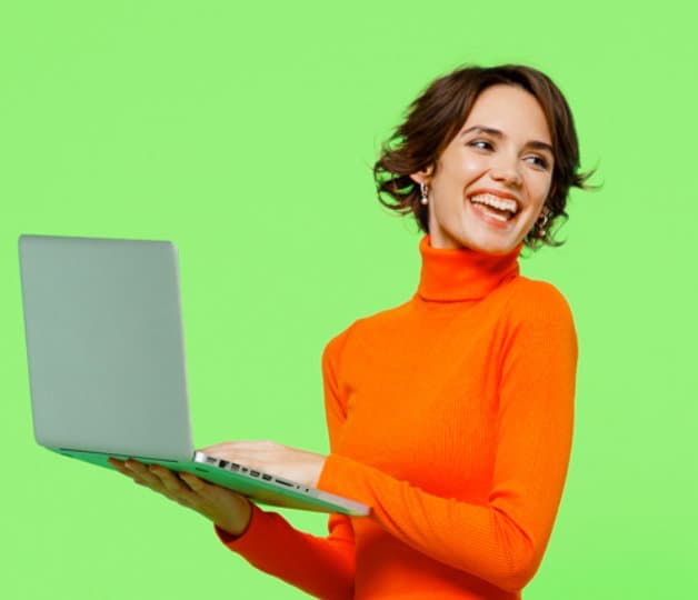 Brunette girl holding laptop and looking over left shoulder