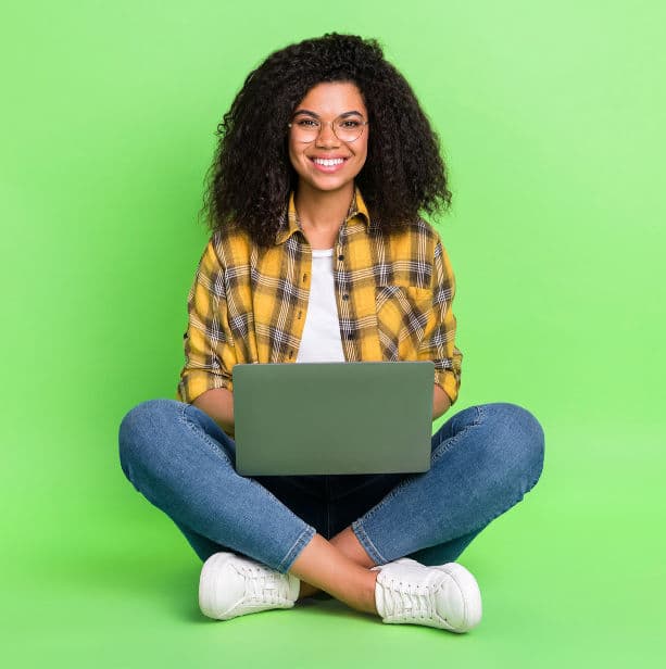 About JobsinED! Girl sitting with laptop facing forward, smiling